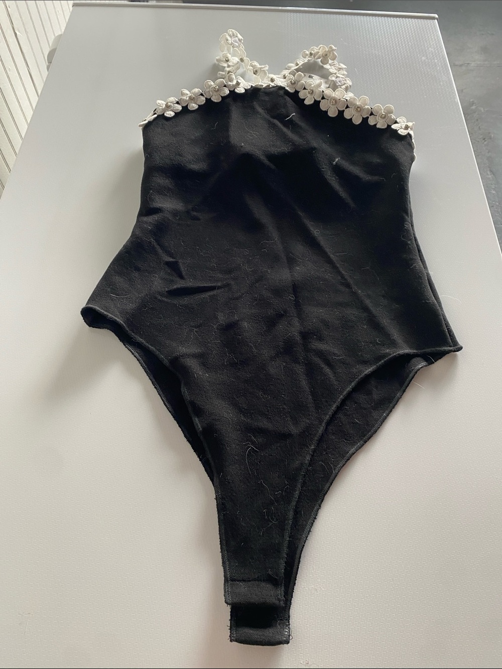 Zara Black Knit Bodysuit with White Floral Trim. Size large-runs small. NWT.